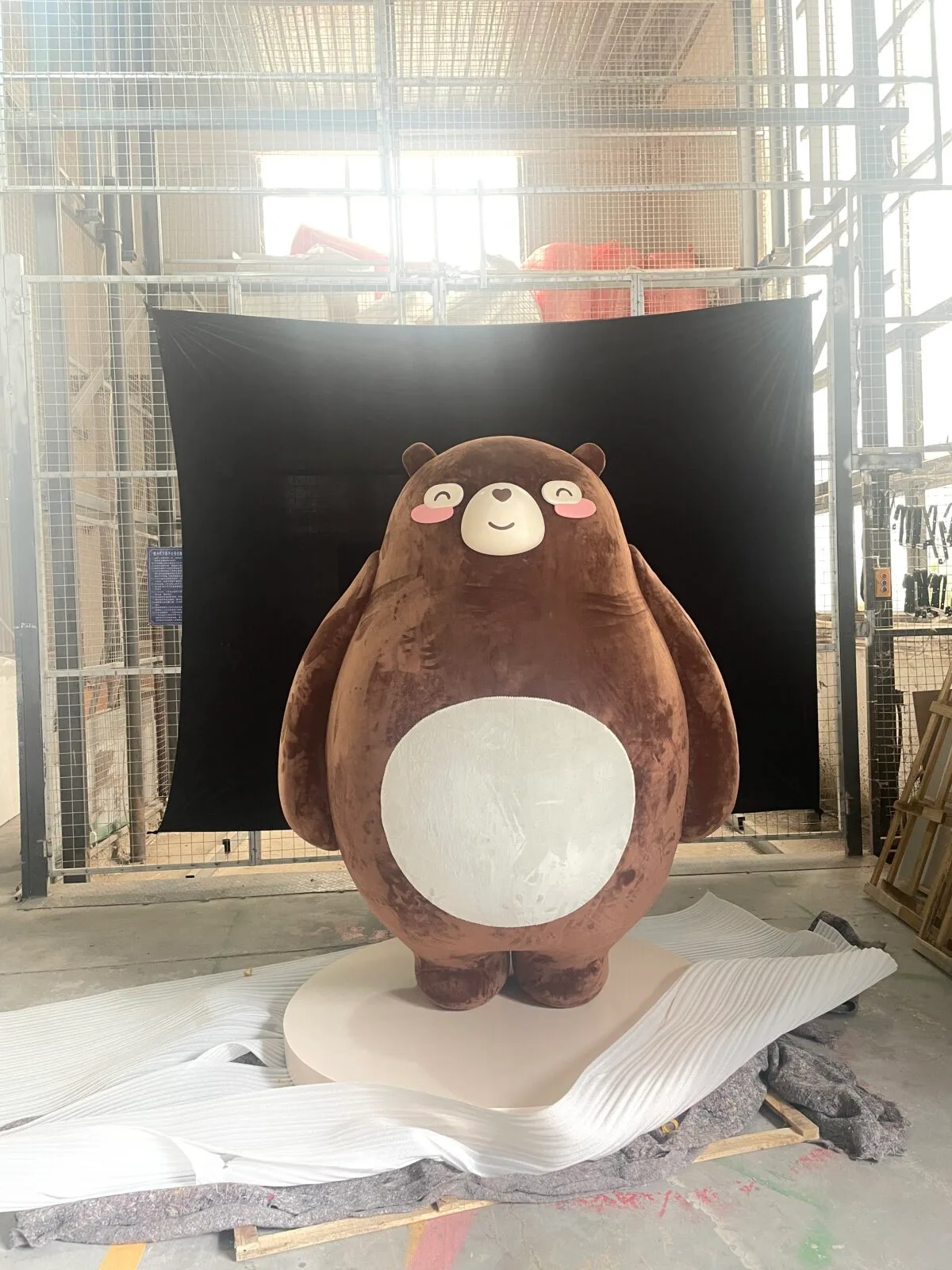 This plush bear display sculpture is crafted from fiberglass, blending cartoon-inspired design with modern artistic charm. Perfect for malls and event showcases, it offers customization options.
